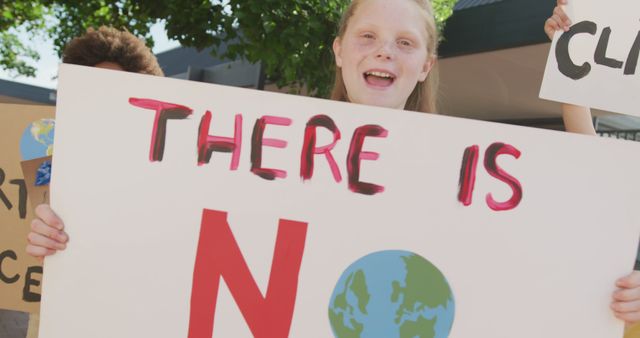 Young Activist Holding Climate Change Protest Sign Outdoors - Download Free Stock Images Pikwizard.com