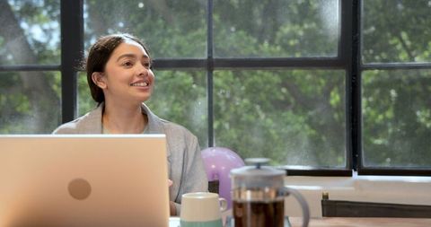 Businesswoman Enjoying Cake Surprise While Working in Modern Office