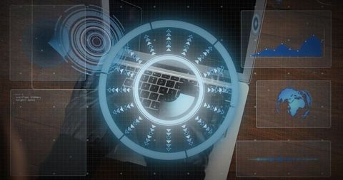 Futuristic holographic dashboard displaying circular hud over laptop keyboard