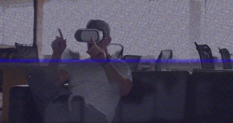 VHS Glitch Effect Over Man Using VR Headset in Office