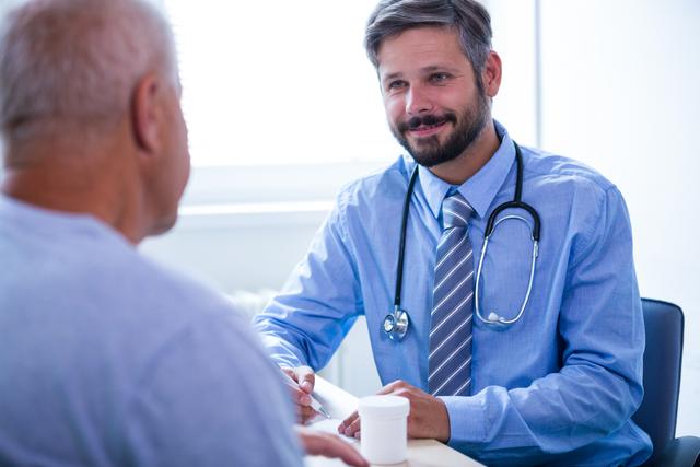 Doctor consulting senior patient in hospital office. Ideal for use in healthcare, medical, and wellness-related content. Perfect for illustrating doctor-patient interactions, medical consultations, and healthcare services for elderly patients.