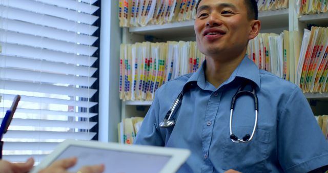 Male Doctor Smiling During Consultation with Patient - Download Free Stock Images Pikwizard.com