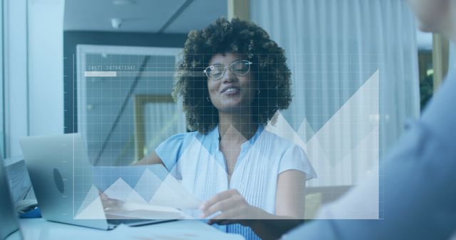 Businesswoman Analyzing Data on Transparent Digital Screen in Office - Download Free Stock Images Pikwizard.com