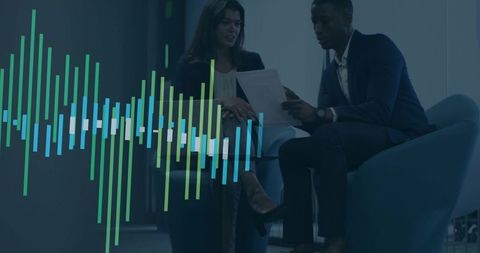 Business Colleagues Discussing Report in Modern Office with Data Visualization Overlay