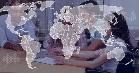 Global business team reviewing strategy documents at meeting table with world map overlay
