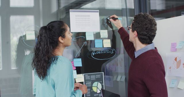 Colleagues Brainstorming Ideas on Glass Board in Office Workspace - Download Free Stock Images Pikwizard.com