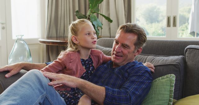 Father and Daughter Sharing a Happy Moment on Couch - Download Free Stock Images Pikwizard.com