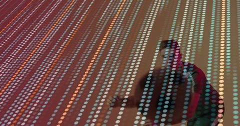 Man engaging with vibrant led panel display in modern space