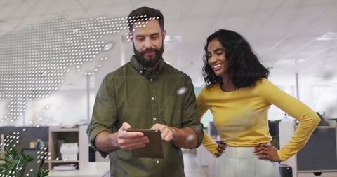 Diverse Colleagues Discussing Digital Global Financial Data in Office