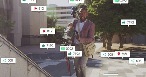 Urban commuter carrying bicycle across plaza wearing pink blazer with social media badges