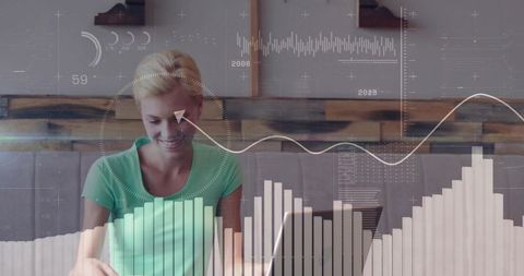 Remote worker analyzing data on laptop in cafe with abstract analytics overlays