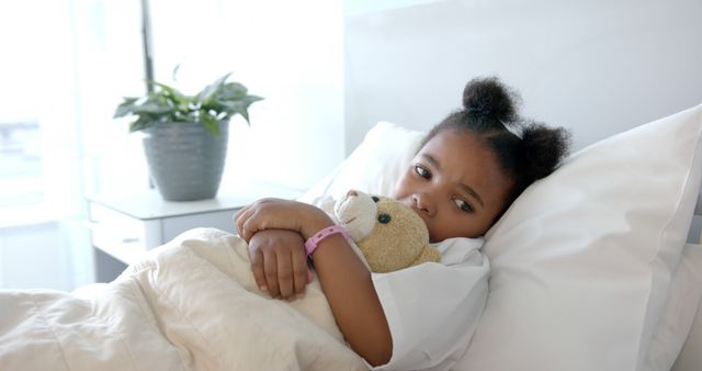 Young Girl in Hospital Bed Holding Teddy Bear - Download Free Stock Images Pikwizard.com