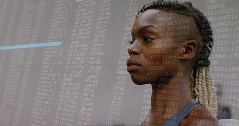 Focused woman analyzing data codes with error overlay