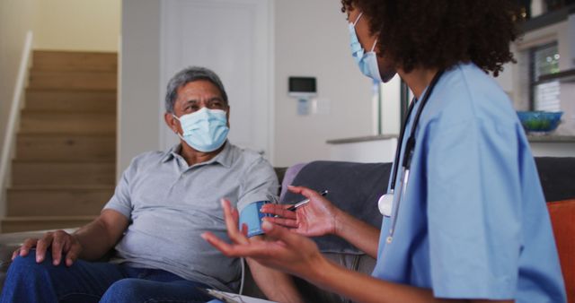 Home Healthcare Nurse Consulting Senior Patient with Face Masks - Download Free Stock Images Pikwizard.com