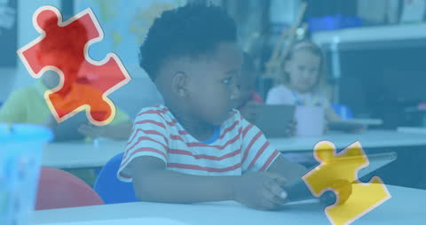 Diverse Schoolchildren Using Tablets with Puzzle Pieces Overlay