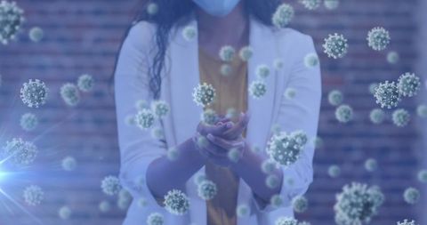 Woman in Face Mask Using Hand Sanitizer with Floating COVID-19 Virus Particles