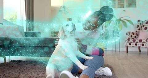 Woman petting dog in cozy living room with turquoise sparkle glow and warm daylight