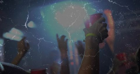 Concert Crowd Raising Red Cup with Neon Wristband, Lens Flare and Vintage Scratched Look
