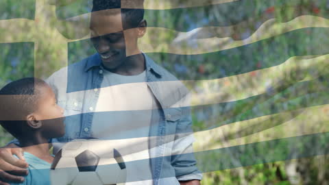 Father and Son with Football Overlaid with Greek Flag