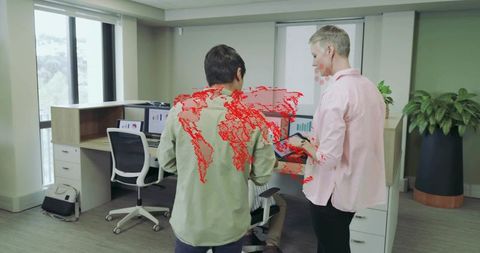 Colleagues Collaborating with Tablet in Modern Office Setting