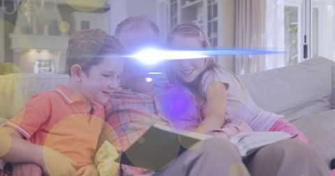 Grandfather Reading Book with Grandchildren on Cozy Living Room Sofa