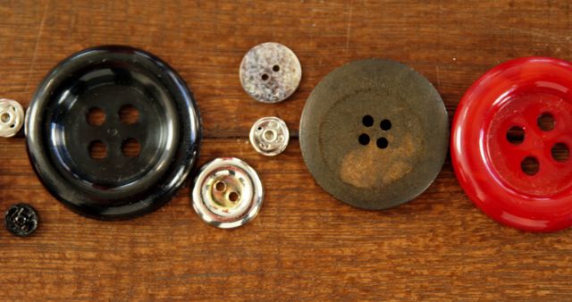 Close-Up of Assorted Buttons on Wooden Surface - Download Free Stock Images Pikwizard.com
