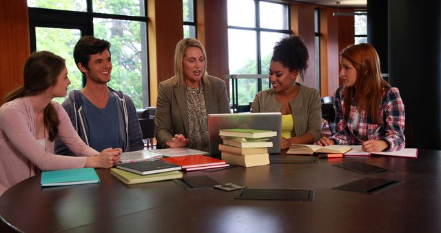 University Students Collaborating with Professor in Library Discussion - Download Free Stock Images Pikwizard.com