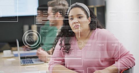 Financial Analysts Collaborating with Data Visualizations in Office