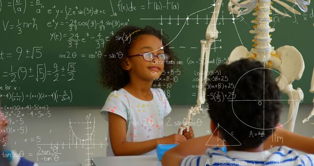 Image of mathematical equations floating over schoolchildren sitting in classroom, looking at human skeleton model. Education back to school concept digitally generated image.