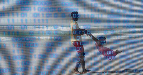 Father swinging daughter on beach wearing vr headsets with blue binary overlay