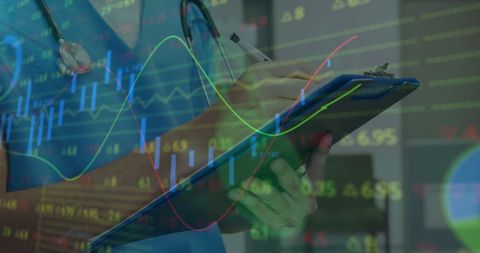 healthcare professional analyzing financial data with medical report - Download Free Stock Images Pikwizard.com