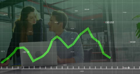 Colleagues Analyzing Financial Graph on Laptop