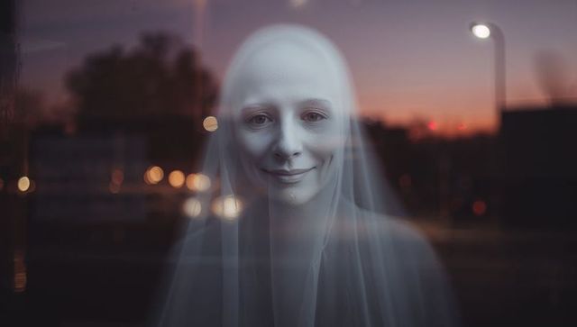 Ethereal Ghostly Figure Behind Glass at Dusk with Bokeh Lights