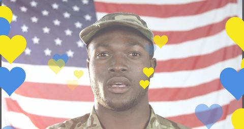 Patriotic Soldier Singing Anthem Overlayed with Heart Symbols