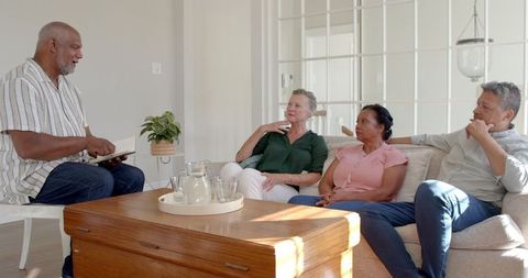 Seniors Enjoying Conversational Moment in Cozy Living Room