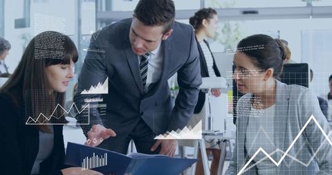 Professionals Analyzing Data in Modern Open-Plan Office