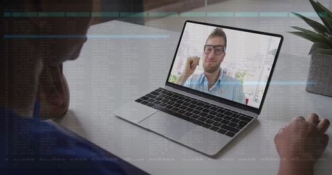 Telemedicine Consultation with Scrub Medic via Laptop