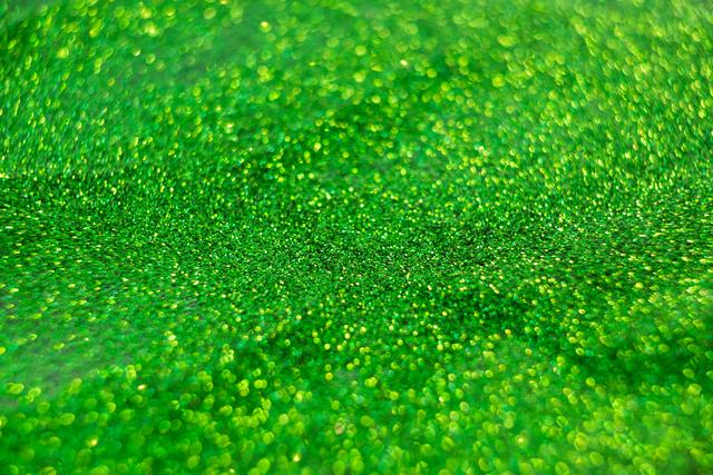 This vibrant green glitter texture is perfect for festive and holiday-themed designs, such as Christmas and New Year celebrations. It can be used as a background for greeting cards, invitations, posters, and social media graphics. The sparkling and shimmering effect adds a touch of glamour and excitement to any project.