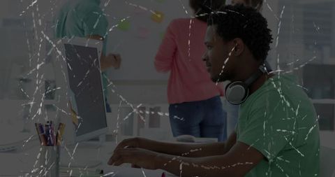 Software developer collaborating in modern office with team