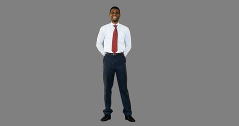 Confident Businessman Smiling in Formal Attire on Grey Background - Download Free Stock Images Pikwizard.com