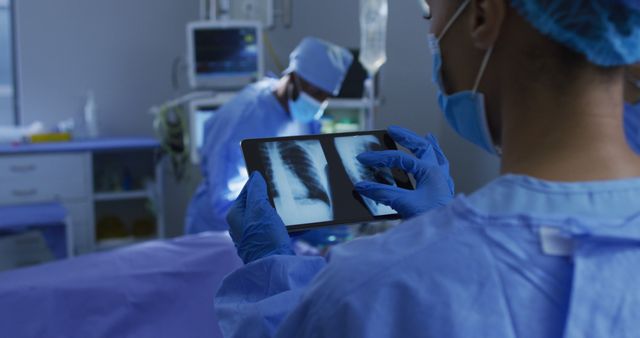 Healthcare Professionals Reviewing X-Ray in Surgical Room Setting - Download Free Stock Images Pikwizard.com