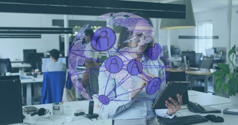 Mid-Adult Korean Woman Exploring Global Digital Network in Modern Office