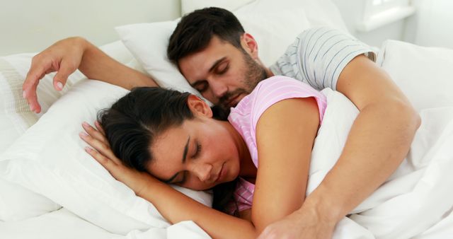 Couple sleeping on bed in bedroom at home - Download Free Stock Photos Pikwizard.com