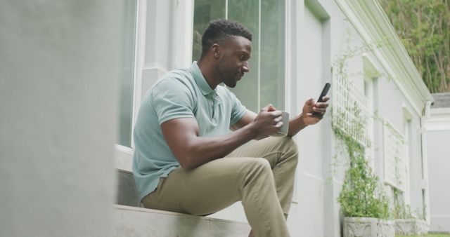 Happy Man Sitting on Steps Using Smartphone Outside Home - Download Free Stock Images Pikwizard.com