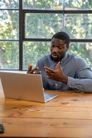 Confident professional communicating in modern office environment