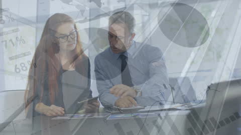 Business Professionals Analyzing Financial Data on Tablet