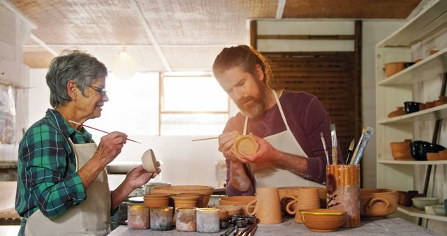 Senior Woman and Young Man Engaged in Pottery Craft Together - Download Free Stock Images Pikwizard.com