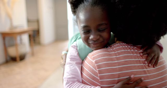 Loving Child Hugging Parent Indoors - Download Free Stock Images Pikwizard.com