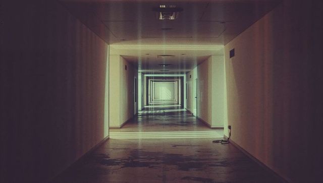 Futuristic industrial corridor with receded lighting