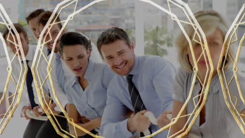 Business Team Engaging in Office Tug of War